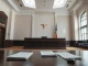 Courtroom interior with legal documents and a judge's bench, symbolizing the OpenAI trial.