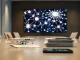 Corporate boardroom with AI network visualization on screen and model airplane on table representing enterprise AI deals and Spirit Airlines crowdfunding.