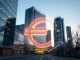 European stablecoin adoption symbolizing financial innovation with a glowing euro symbol over a city.