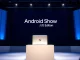Google Android Show event stage with Googlebooks laptop and digital screen