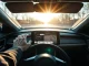 Car dashboard with Google Gemini AI assistant interface on touchscreen display