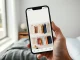 Smartphone showing Google Photos AI digital closet interface with organized clothing items
