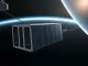 Orbital data center module in space with Earth in the background, representing Google and SpaceX partnership