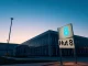 Hut 8 data center facility at dusk with sign in foreground