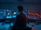 Professional trading desk with monitors showing Bitcoin and Ethereum ETF data and charts