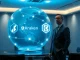 Kraken parent Payward and Reap merger visualization in Hong Kong boardroom with blockchain hologram