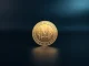 Monero XMR coin on dark surface with soft studio lighting for cryptocurrency price prediction article