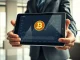 Financial professional analyzing data for the Morgan Stanley Bitcoin ETF with its low 0.14% fee.