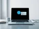 OpenAI GPT-5.5 Instant ChatGPT interface on a laptop with a glowing AI brain icon, representing the new default model's advanced capabilities.