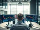 Professional trading desk with monitors showing event contract data and charts