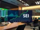 Sei (SEI) price chart with bullish trend on a financial display in a modern newsroom setting.