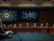 U.S. Senate committee hearing on crypto regulation with blockchain display