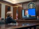 Senator Elizabeth Warren questioning Meta CEO Mark Zuckerberg about stablecoin plans in a Senate hearing room.
