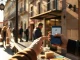 Person using smartphone for a payment at a Spanish café, representing retail EURC stablecoin usage.