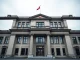 Exterior of the Swiss National Bank headquarters in Bern on a cloudy day.