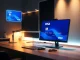 Oobit AI agent Visa card interface on a monitor in a modern office setting