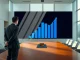 Executive analyzing Bitcoin treasury holdings data in corporate boardroom setting