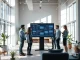 Team at Stockholm AI startup Pit gathered around a monitor showing AI automation workflows
