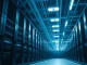 Interior of a large, modern data center with rows of server racks and cooling infrastructure, representing the Colossus 1 facility.