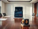 Laptop displaying Ethereum price chart on a boardroom table with a Bitcoin mining rig model.