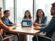 Business meeting discussing Dash crypto payments in a Manila office with skyline view.