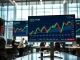 Trading floor with screens showing Bitcoin perpetual futures charts and data