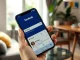 Smartphone displaying Facebook's new AI Mode search feature in a bright, modern setting.