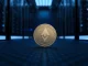 A Monero (XMR) coin resting in a secure, dimly lit server room, symbolizing digital privacy and cryptography.