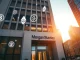 Morgan Stanley headquarters with digital Ethereum and Solana symbols overlaying the scene