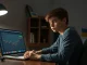 Teenager Alexander Browder at a laptop, working on cryptocurrency sanctions research