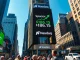 Nasdaq building in Times Square displaying SpaceX stock price after IPO