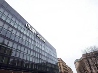 Exterior of the Spanish CNMV headquarters in Madrid, a modern glass building under overcast skies.