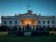 UFC octagon on White House lawn at dusk with American flag