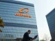 Alibaba corporate headquarters in Shanghai on a clear day, representing the company's technology policy decision.