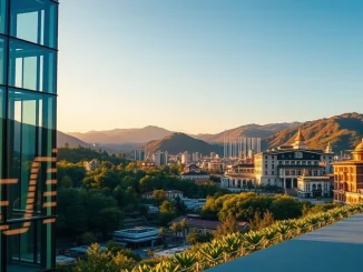Gelephu Mindfulness City skyline with digital Bitcoin symbol integrated into architecture at sunset.