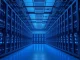 Interior of a large cryptocurrency mining facility with rows of glowing servers
