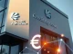 Crédit Agricole bank building with digital euro and blockchain network overlay representing EURXT stablecoin launch