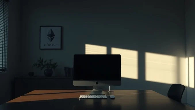 Empty office desk with a powered-down monitor and an Ethereum logo on the wall, representing the disbanding of the Ethereum Protocol Support Team.