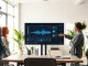 Team of engineers at Fish Audio discussing AI voice model development in a Palo Alto office.