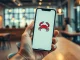 Smartphone displaying OpenClaw AI agent app interface with crustacean icon in a modern workspace setting