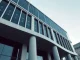 Modern bank building with digital encryption overlay symbolizing quantum-resistant crypto transfers