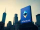 BlackRock ETHA reverse split and staked Ether ETF strategy visual with Ethereum symbol on financial district billboard