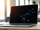 Laptop displaying a unified AI memory interface for Claude, representing the new sync between chat and Cowork.