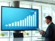 Analyst reviewing financial data on a screen in a modern fintech office, representing Figure's loan marketplace growth.