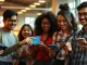 Students using Google's AI study tools on smartphones, showing a 3D DNA model