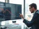 Analyst reviewing declining BERA token chart on screen in office setting
