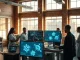 Team of researchers collaborating in a modern AI lab in London, with screens showing scientific data