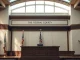 Federal courthouse interior with judge's bench and American flag, symbolizing the legal ruling in the Kalshi case.