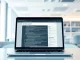 Laptop screen displaying code and text, representing AI-generated web content