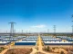 Aerial view of data center buildings and transmission lines in Texas